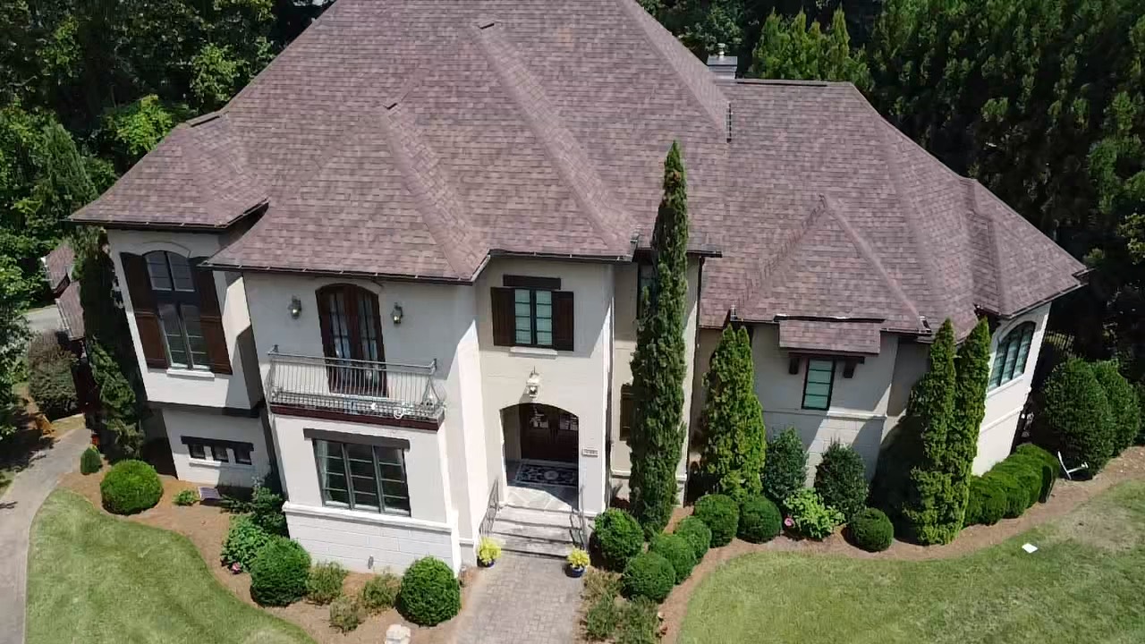 Front aerial view of the completed Brownwood roof on a large South Charlotte residence