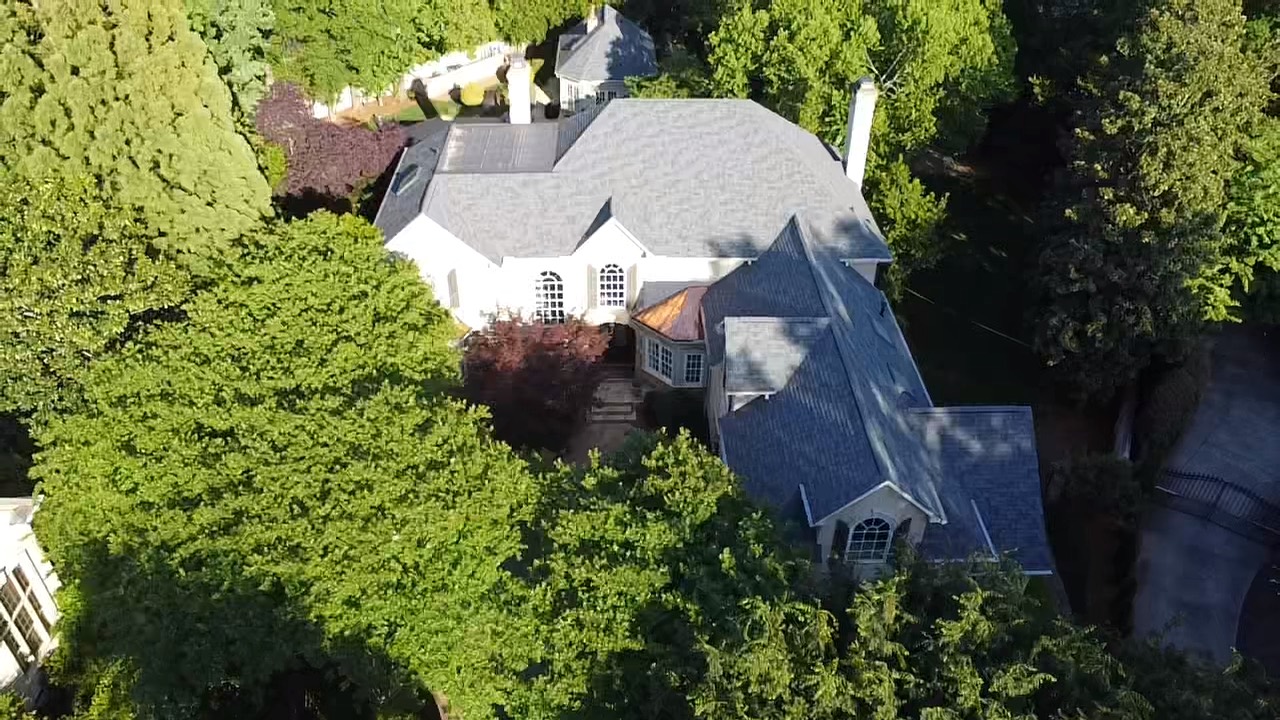 Aerial view of a completed roof and custom copper bay-window restoration